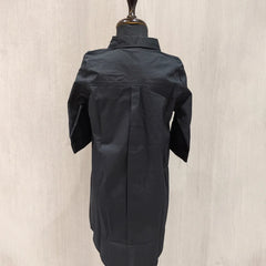 Black jacket on a mannequin against a beige background