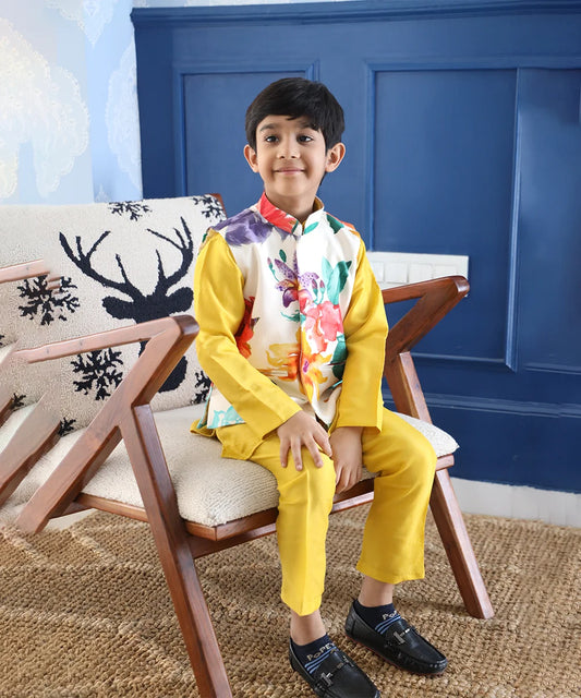 It is a yellow Colored kurta pyjama set that comes with a matching waistcoat, can be creatively styled with ethnic shoes and is the best boy's designer kurta-pyjama set.