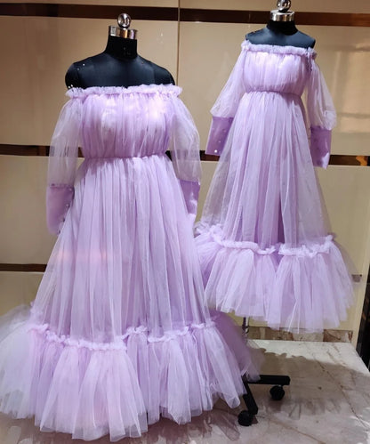  It’s a lavender Colored gown for a mother-daughter duo. A perfect children's birthday dress and party gown for moms. It features pleated and frill detailing on the yoke and ruffles at the bottom.