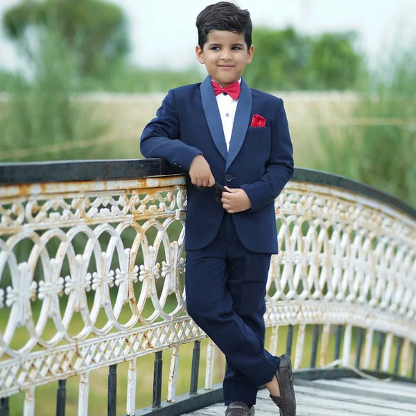 An elegant Suit set that comes with a blue coat, white shirt and blue pants perfect for every formal occasion. This top-line quality suit set is paired with a beautiful red coloured bow and a pocket square.
