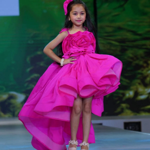 Neon pink party dress for girls with big floral detail and up-and-down hemline, Jaipur