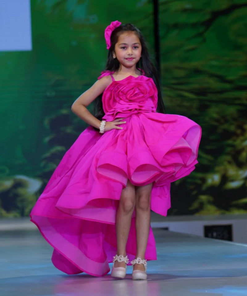 Neon pink party dress for girls with big floral detail and up-and-down hemline, Jaipur