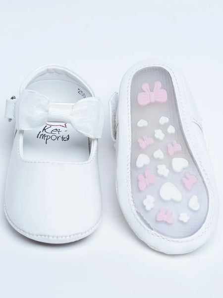 Close-up of newborn white shoes with soft bow accent and cushioned insole, Jaipur