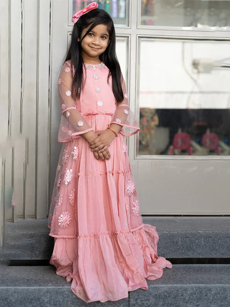 pink wedding wear gown paired with a shrug for girls 