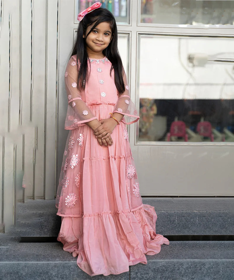 pink wedding wear gown paired with a shrug for girls 