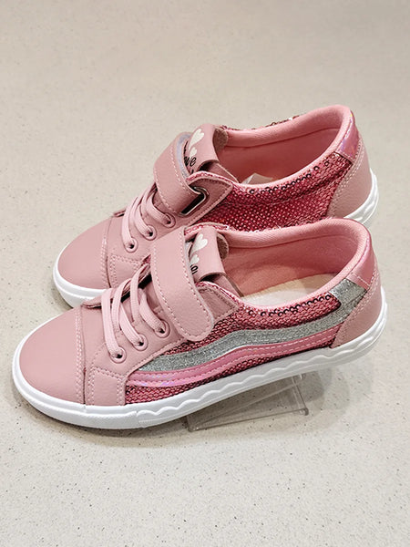 Pair of pink children's sneakers with white soles on a light gray background