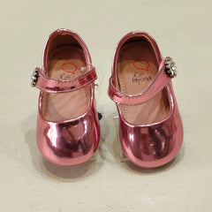 Close-up of toddler girls' shiny pink party flats featuring gem strap and rounded toe, Jaipur

