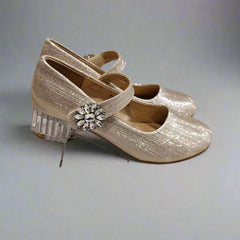 Close-up of girls' sparkling gold dress shoes with decorative gem detail and round toe, Jaipur

