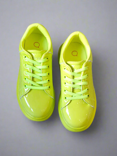 Close-up of fluorescent lime sports sneakers for girls, perfect for active play in Jaipur