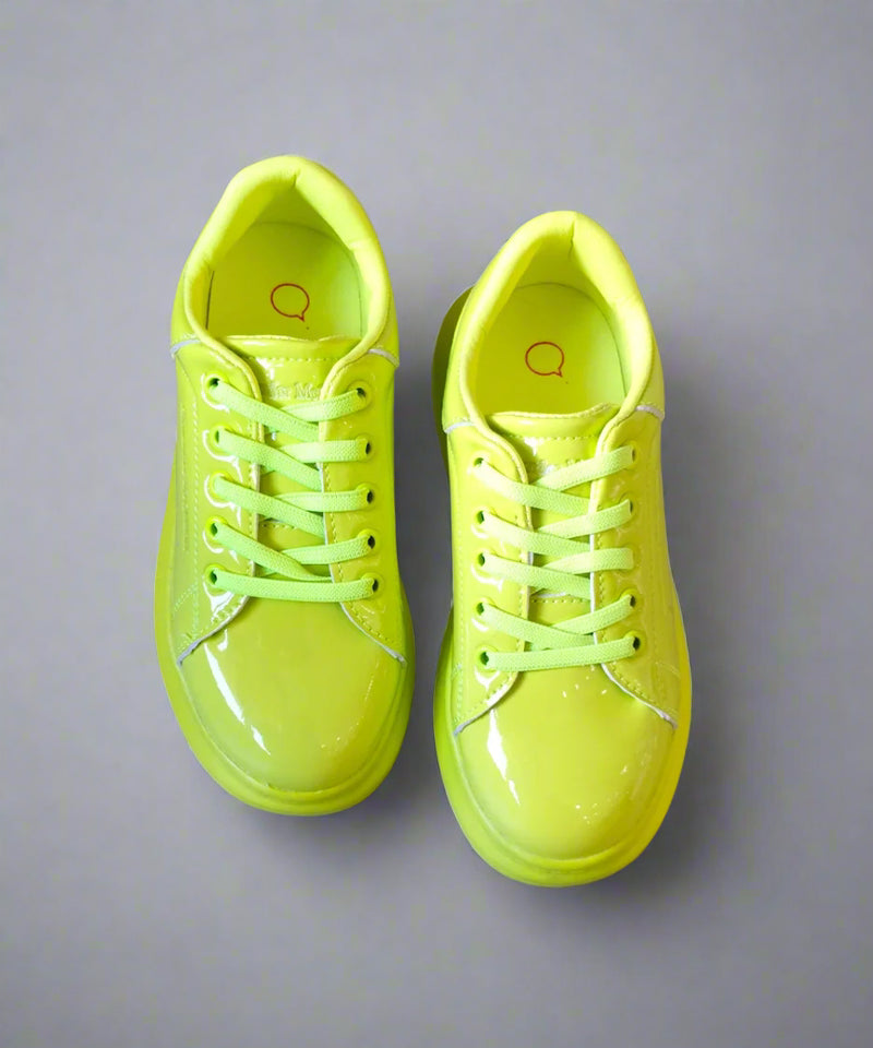 Close-up of fluorescent lime sports sneakers for girls, perfect for active play in Jaipur
