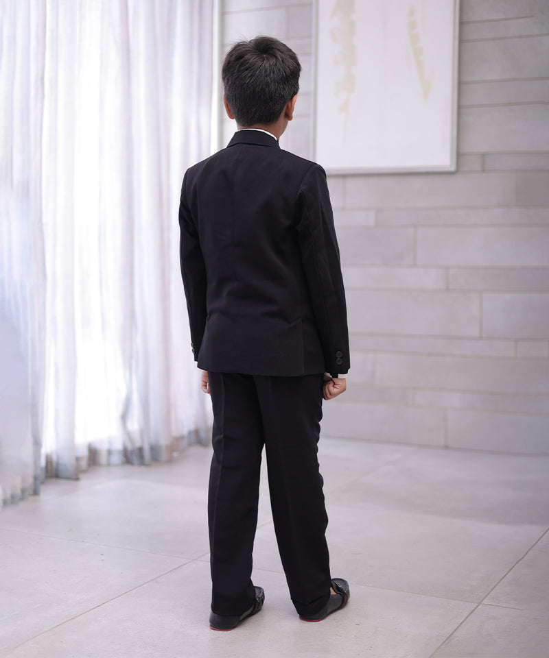 back view of black coat suit set for boys