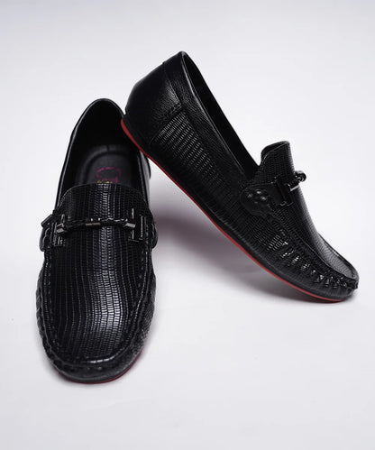 It's a pair of black colour-blocked round-toed formal loafers.
