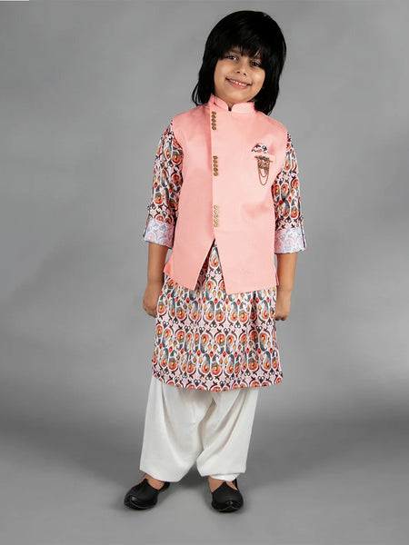 Representing this beautiful sleeveless solid jacket in peach with a golden broach and a pocket square, paired with a soft cotton blend kurta and matching cream colored Patiala.