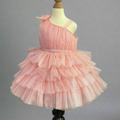 It's a peach Colored frock that features a cute bow on the shoulder and pearl belt attached on the waist.