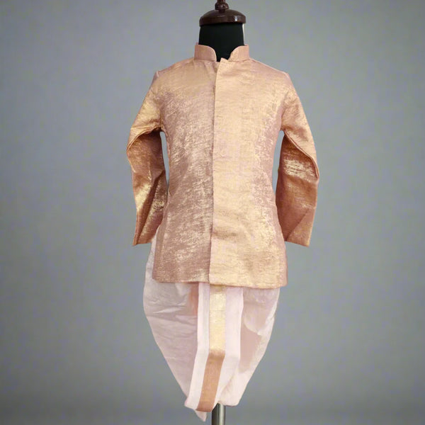 A peach color shimmer kurta dhoti set for boys displayed on a mannequin.