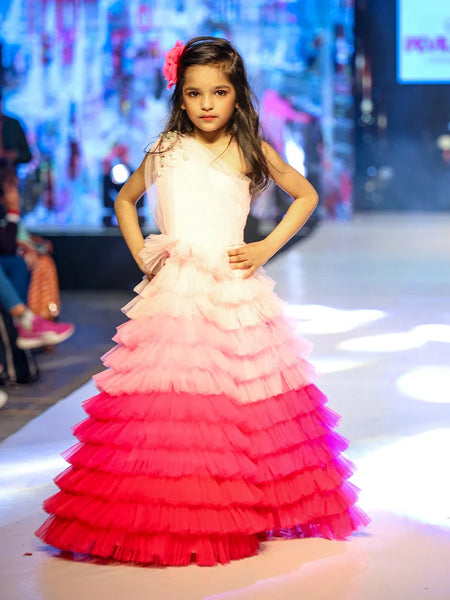 It’s a fancy ruffle gown that features a beautiful pearl detailing on the shoulder that uplifts the entire look.