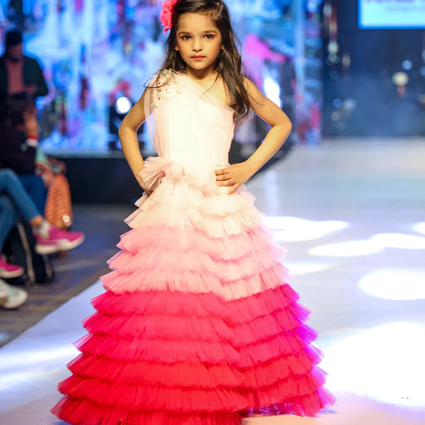 It’s a fancy ruffle gown that features a beautiful pearl detailing on the shoulder that uplifts the entire look.