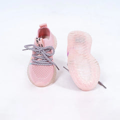Close-up of trendy girls' pink mesh sneakers with lace-up design and transparent sole, Jaipur

