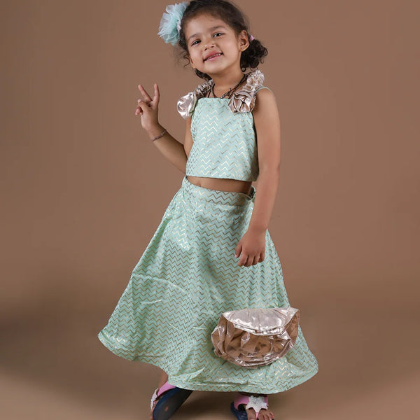 This pista green Colored lehenga consist of a choli, skirt and asymmetric dupatta and comes with a back hook closure. It features beautiful floral detailing on the choli, skirt and dupatta. Also, choli has a beautiful dori detailing at the back.