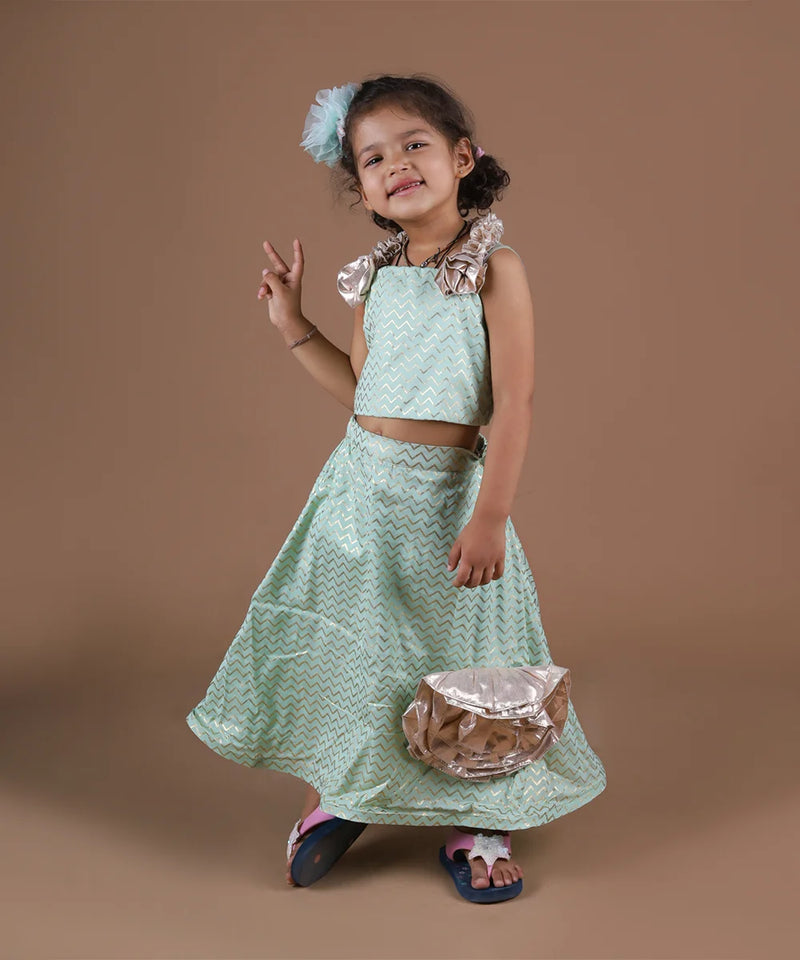 This pista green Colored lehenga consist of a choli, skirt and asymmetric dupatta and comes with a back hook closure. It features beautiful floral detailing on the choli, skirt and dupatta. Also, choli has a beautiful dori detailing at the back.