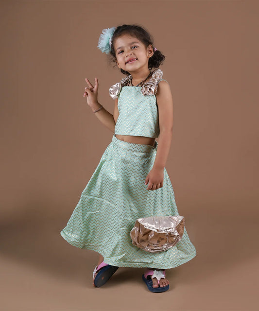 This pista green Colored lehenga consist of a choli, skirt and asymmetric dupatta and comes with a back hook closure. It features beautiful floral detailing on the choli, skirt and dupatta. Also, choli has a beautiful dori detailing at the back.