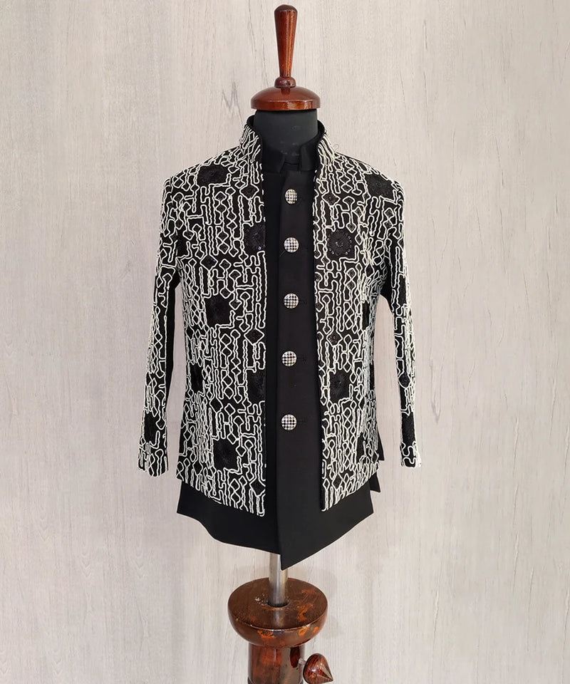Black and white patterned jacket on a mannequin against a light background