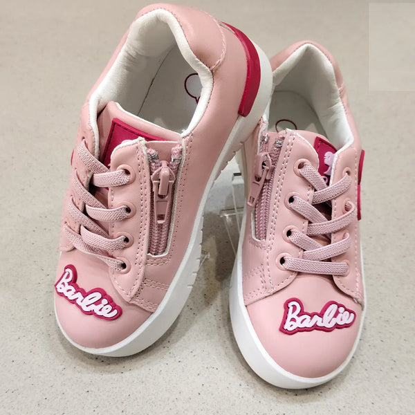 Pink sneakers with 'Barbie' logo on a light gray background