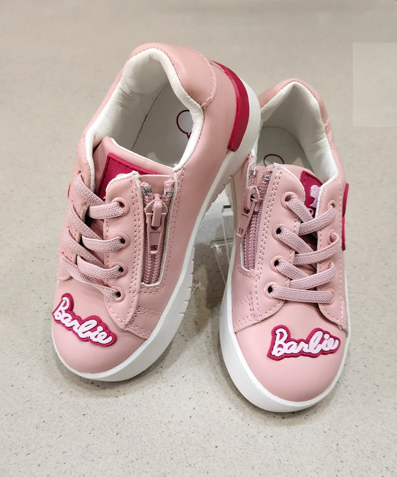 Pink sneakers with 'Barbie' logo on a light gray background