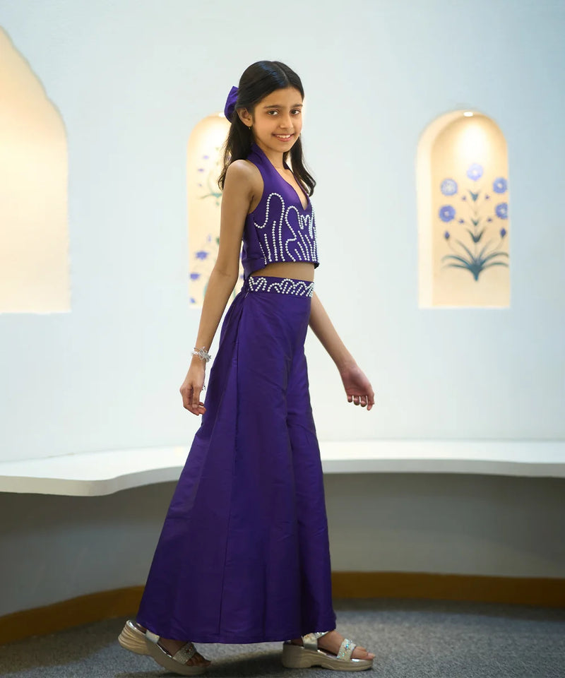 designer purple crop top & flared pants co-ord set with hair accessories for girls 