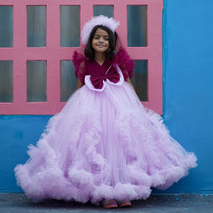 It’s a fancy frill gown, a perfect children birthday dress that comes with a matching hair accessory.