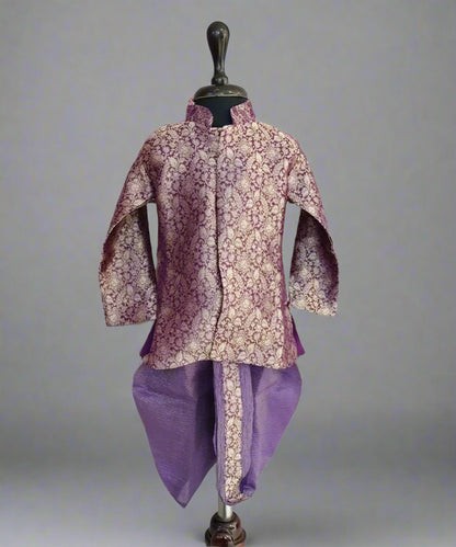 A purple colored dhoti-kurta set for boys displayed on a mannequin.