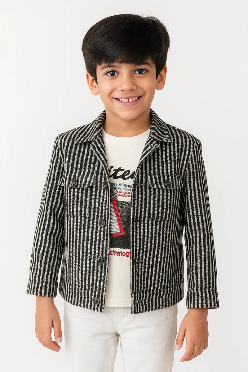 Child wearing a striped jacket over a graphic t-shirt on a white background