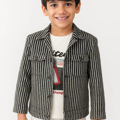 Child wearing a striped jacket over a graphic t-shirt on a white background
