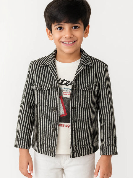 Child wearing a striped jacket over a graphic t-shirt on a white background