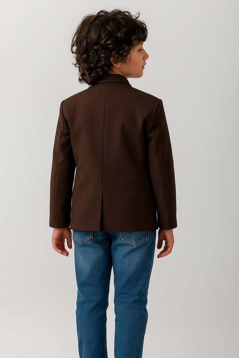 Child wearing a brown jacket and blue jeans on a white background