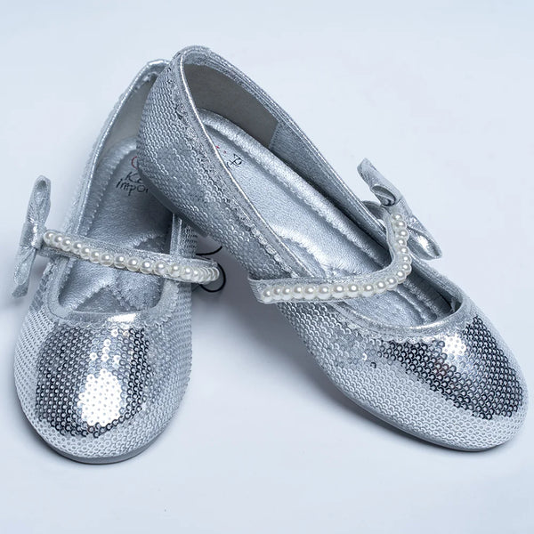 It's a pair of silver sequin work sandals with a round-toe. It features pearl detailing and Patterned synthetic outsole.