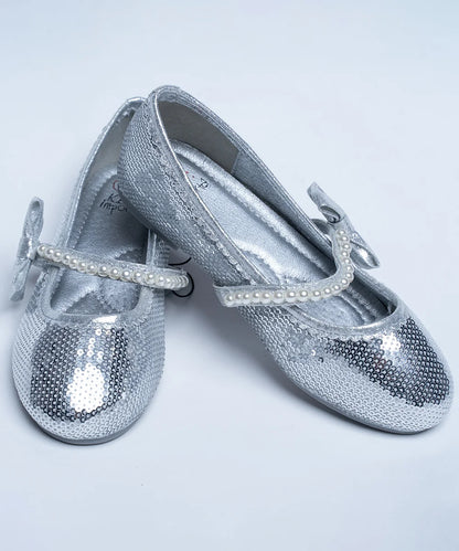 It's a pair of silver sequin work sandals with a round-toe. It features pearl detailing and Patterned synthetic outsole.