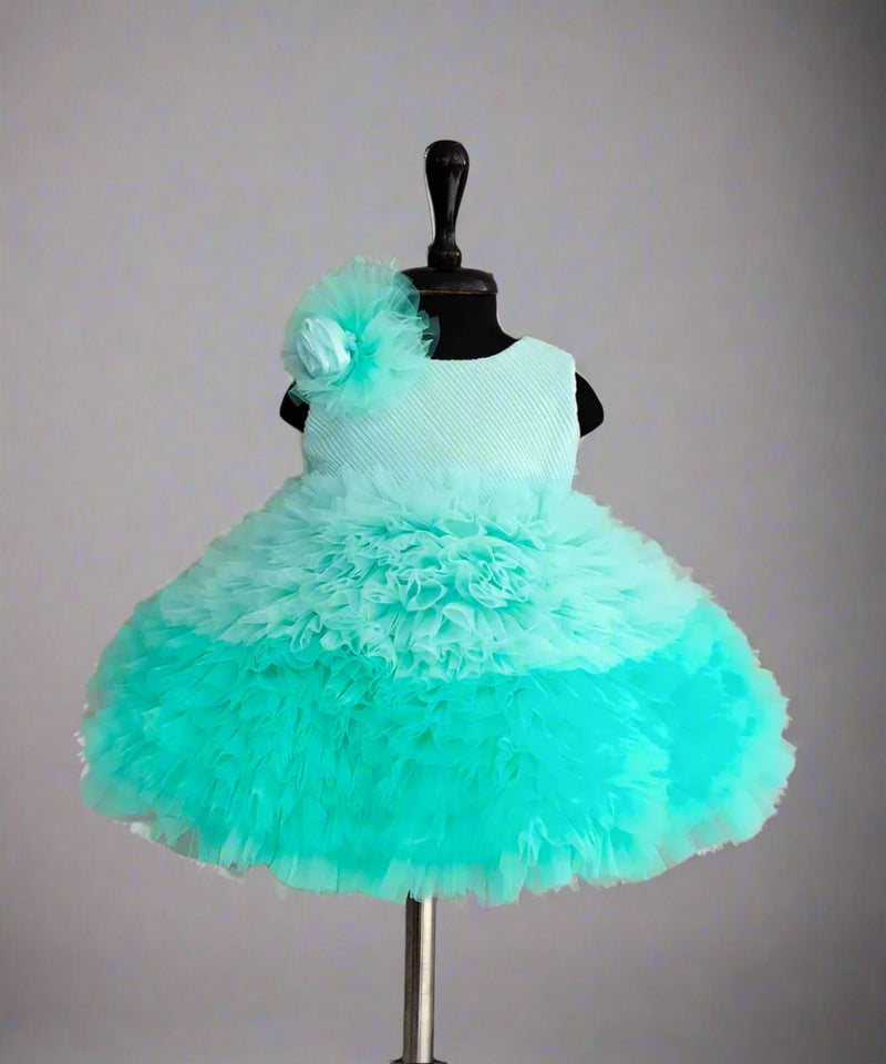 Sea-blue birthday frock for girls with floral shoulder detail, Jaipur kidswear showroom