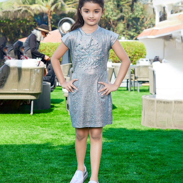 It is a grey Colored party dress for baby girls that comes with a matching Inner and is the best children's birthday dress. It features a big floral applique work in the middle of the dress.