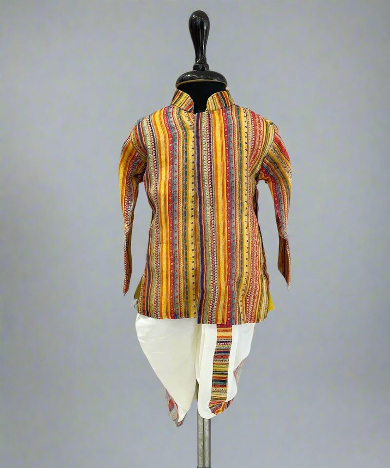 A multicolored striped kurta pyjama set displayed on a mannequin against a wooden backdrop.