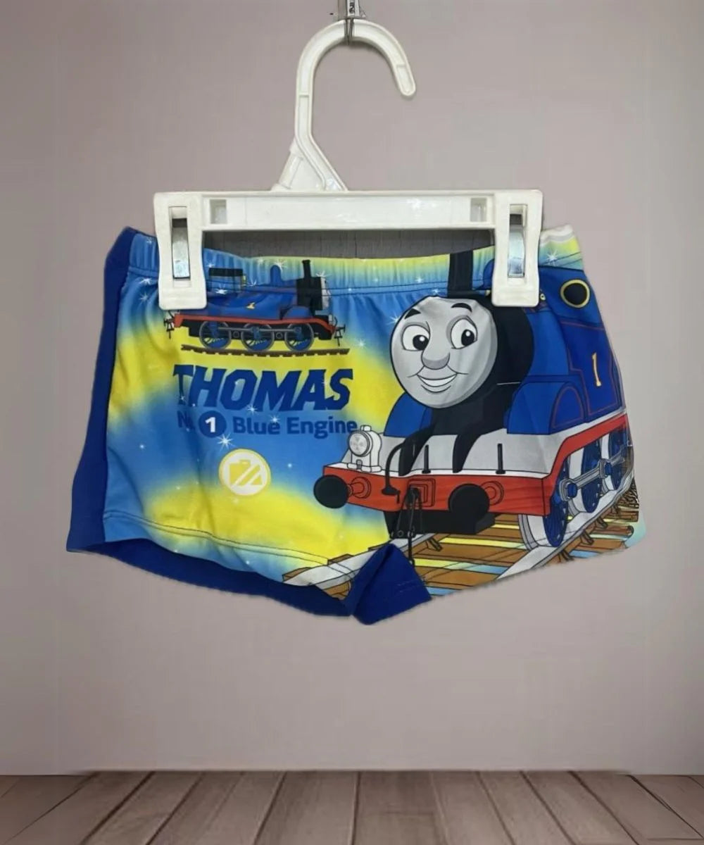 This outfit Consists of blue Colored cartoon-printed shorts for kids pool party.