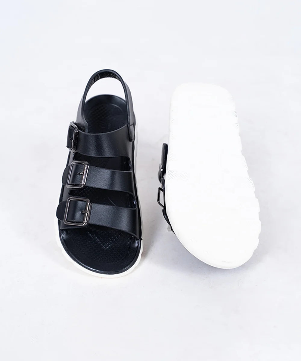 Close-up of trendy black open-toe sandals for boys with metal buckles, Jaipur