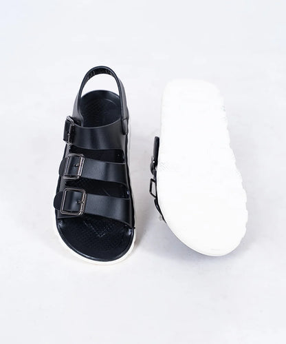 Close-up of trendy black open-toe sandals for boys with metal buckles, Jaipur