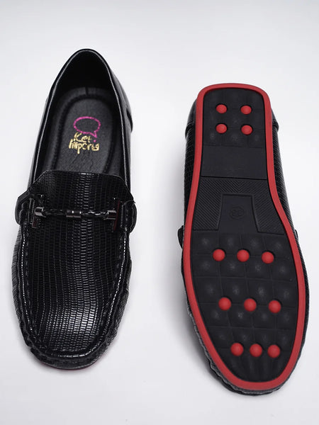 Close-up of trendy kids' black party loafers with red outsole and cushioned insole, Jaipur

