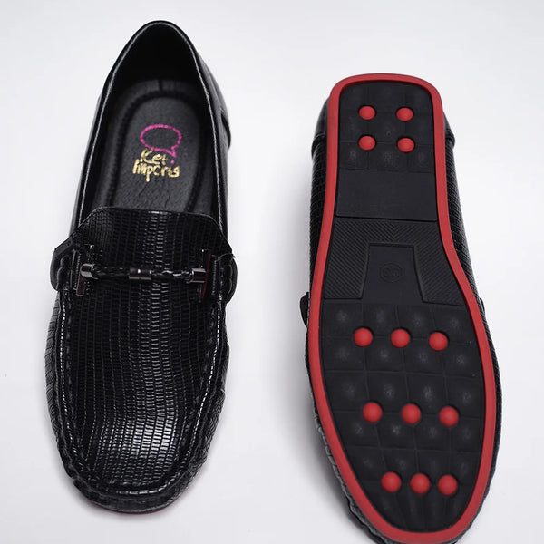 Close-up of trendy kids' black party loafers with red outsole and cushioned insole, Jaipur

