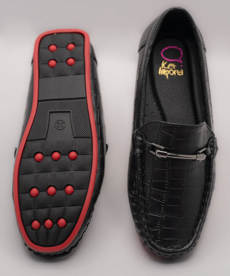 Close-up of trendy kids' black party loafers with cushioned insole and embossed finish, Jaipur