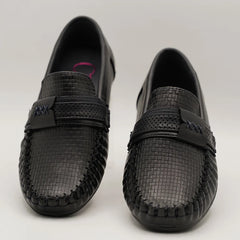 Close-up of trendy kids' black loafers with woven finish and flexible sole, Jaipur