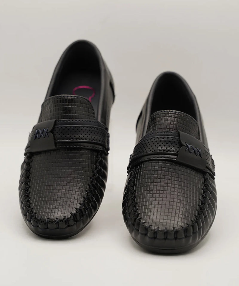 Close-up of trendy kids' black loafers with woven finish and flexible sole, Jaipur