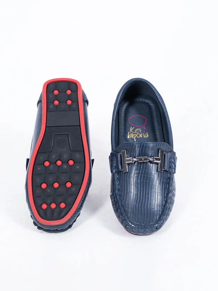 Close-up of trendy kids' navy blue party moccasins with cushioned insole and textured pattern, Jaipur

