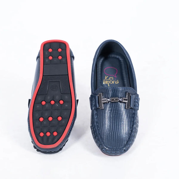 Close-up of trendy kids' navy blue party moccasins with cushioned insole and textured pattern, Jaipur

